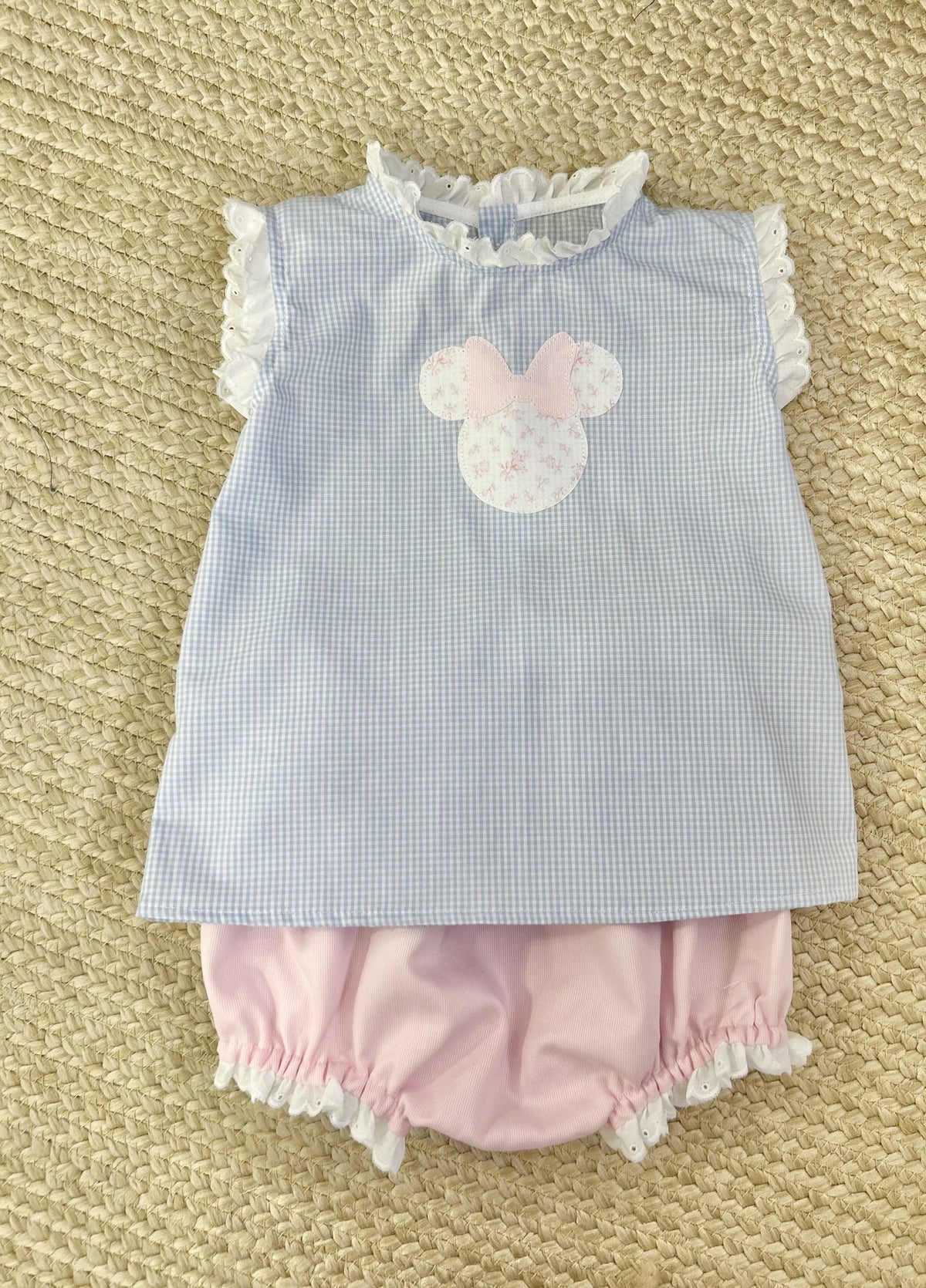 Lily Top in blue gingham with Minnie appliqué and standing eyelet ruffle at neck and arms, shown with pink ruffle bloomer
